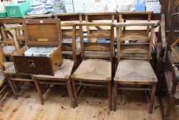 Set of eight rush seated chapel chairs.