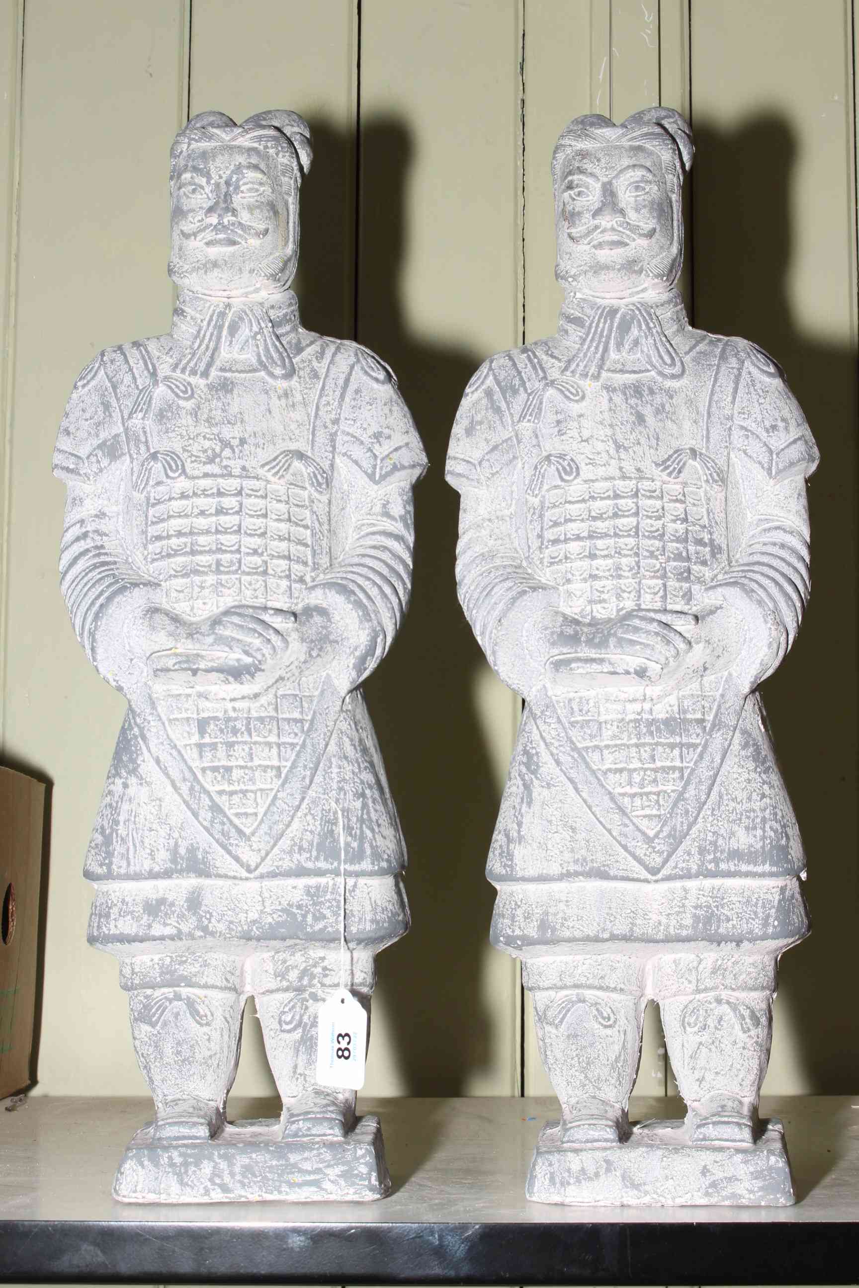 Two composite warrior sculptures, 58cm high.