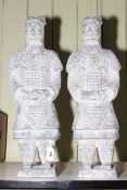 Two composite warrior sculptures, 58cm high.