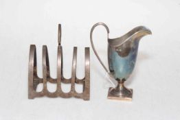 Silver helmet cream jug, Birmingham 1907, and silver five bar toast rack, Sheffield 1939 (2).