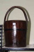 A coopered oak pail with Bentwood handle, 55cm high.