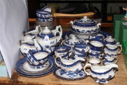 Booths Real Old WIllow blue and white tableware, approximately 65 pieces.