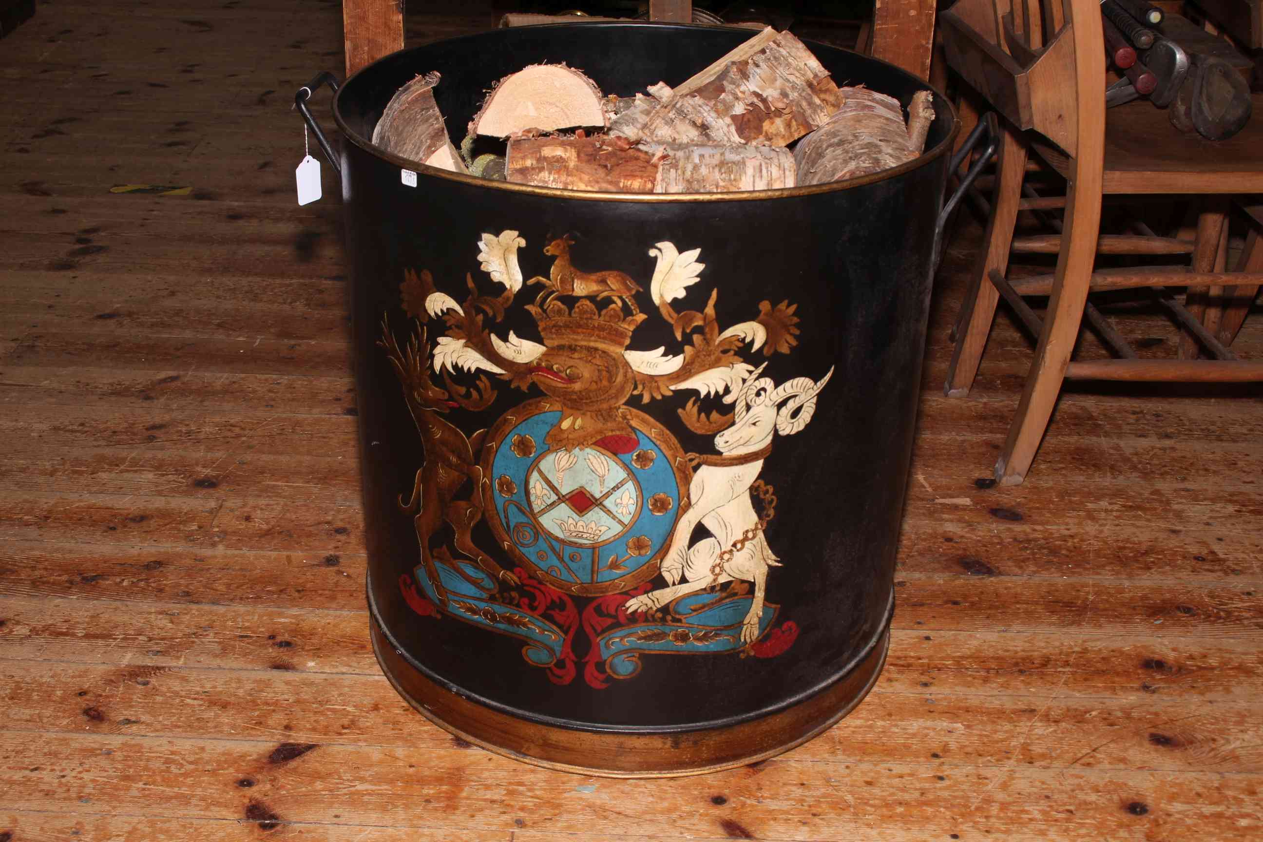 Large Armorial painted two handled log bin and logs, 59cm by 56.5cm diameter.