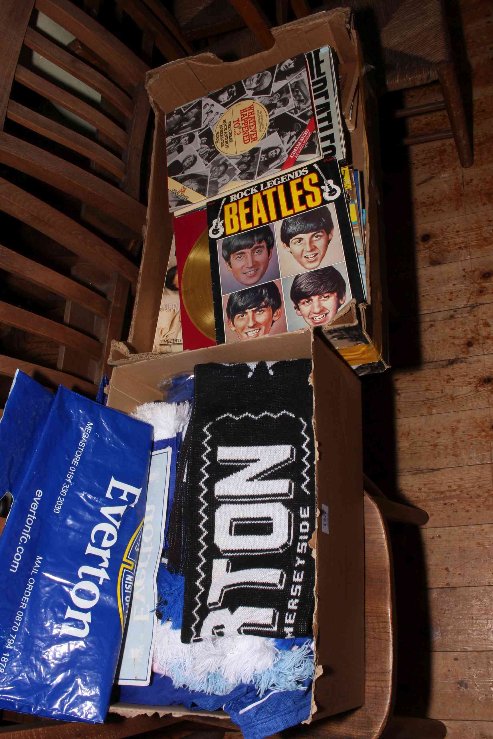 Beatles magazines and books together with Everton football shirts and scarves.