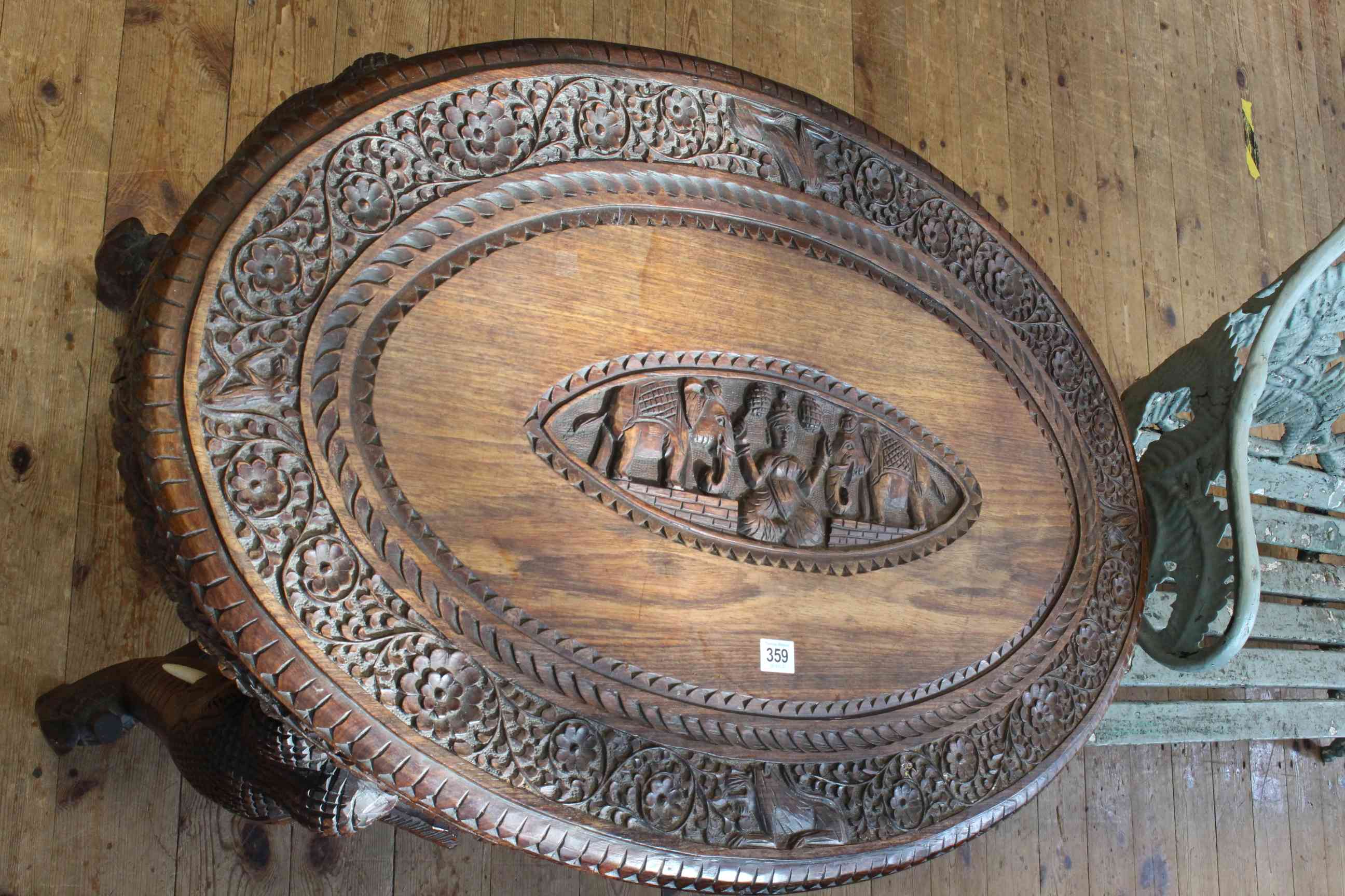 Oval carved rosewood Indian elephant table, 75cm by 93cm by 60cm. - Image 2 of 2