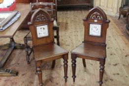 Pair Victorian mahogany Gothic hall chairs with Minton? tile insets depicting Shakespeare plays.