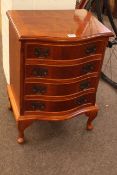 Small yew four drawer serpentine front chest, 58.5cm by 42cm by 35cm.