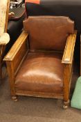 Early 20th Century oak and leather library chair with adjustable back.