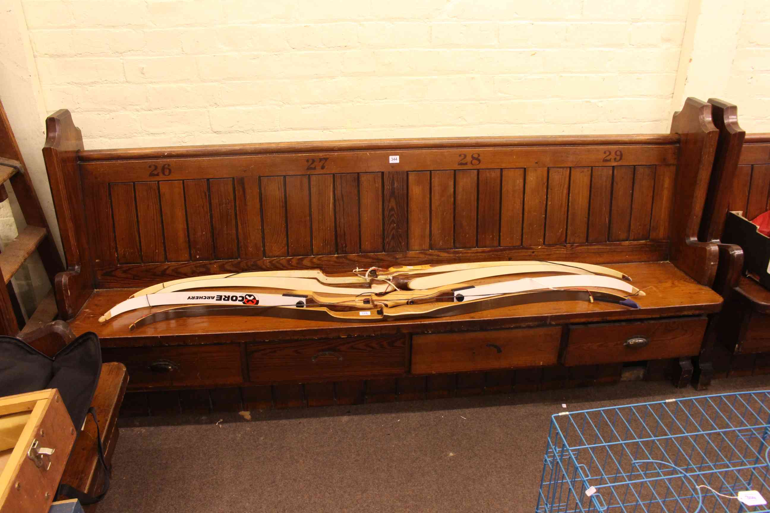 Two Victorian pitch pine four drawer and three drawer storage pews, 214cm and 159cm long.