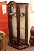 Barker & Stonehouse polished mahogany arched top display cabinet with canted corners and base