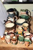 Collection of character toby jugs including Bacchus, Lobster Man, Rip Van Winkle, Athos, etc.