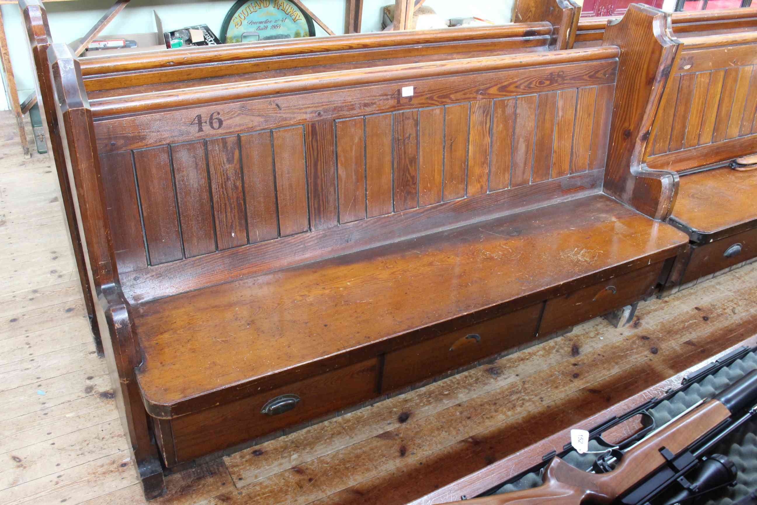 Pair Victorian pitch pine three drawer storage church pews, 160cm long approximately.