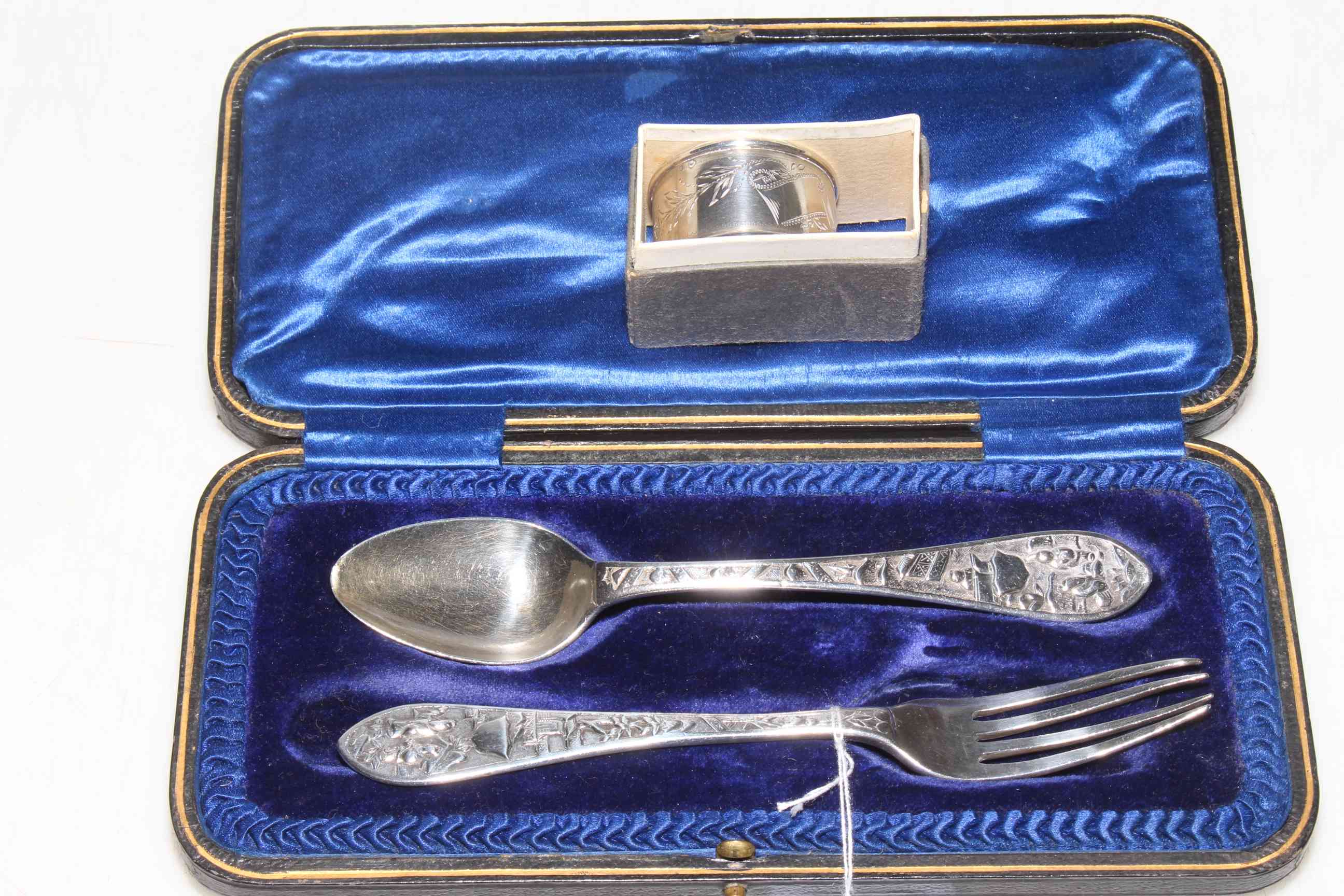 Cased silver christening spoon and fork (?Welsh), and silver napkin ring (2).