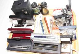 Box camera, binoculars, various wristwatches, fountain and ballpoint pens, cufflinks, etc.