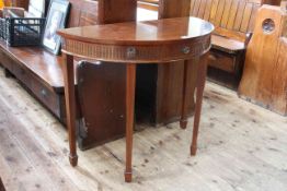 G & W Richardson Ltd, London, mahogany single drawer demi lune hall table, 77cm by 90.5cm by 45cm.