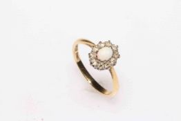 Opal and diamond, platinum and gold ring, size K/L.