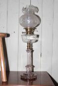 Glass and brass bound oil lamp, 71cm high.