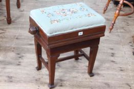 Early 20th Century adjustable piano stool with floral tapestry seat.