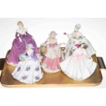 Three Royal Doulton ladies, Royal Worcester Sweet Violet and Wedgwood Rose figures (5).