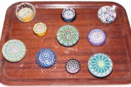 Ten Millefiori glass paperweights, mostly with John Deacons, Scotland, labels.