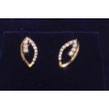 Pair 9 carat gold and diamond set earrings.