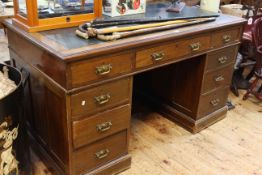 Late Victorian mahogany nine drawer pedestal desk, 76cm by 138cm by 75cm.