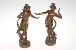 Pair of Continental spelter lady figures, 39cm high.