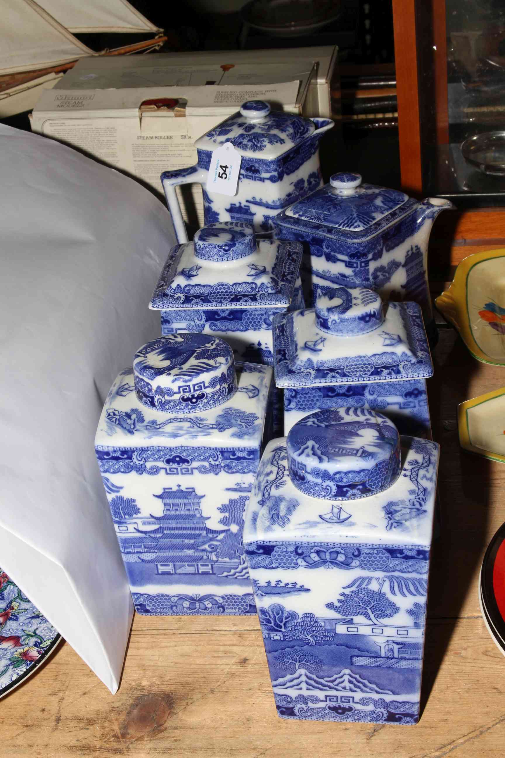 Blue and white Willow pattern Maling caddies and water jugs.