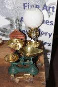 Two sets of kitchen scales and weights, oil lamp, two glass bell decanters, copper salt tin, etc.