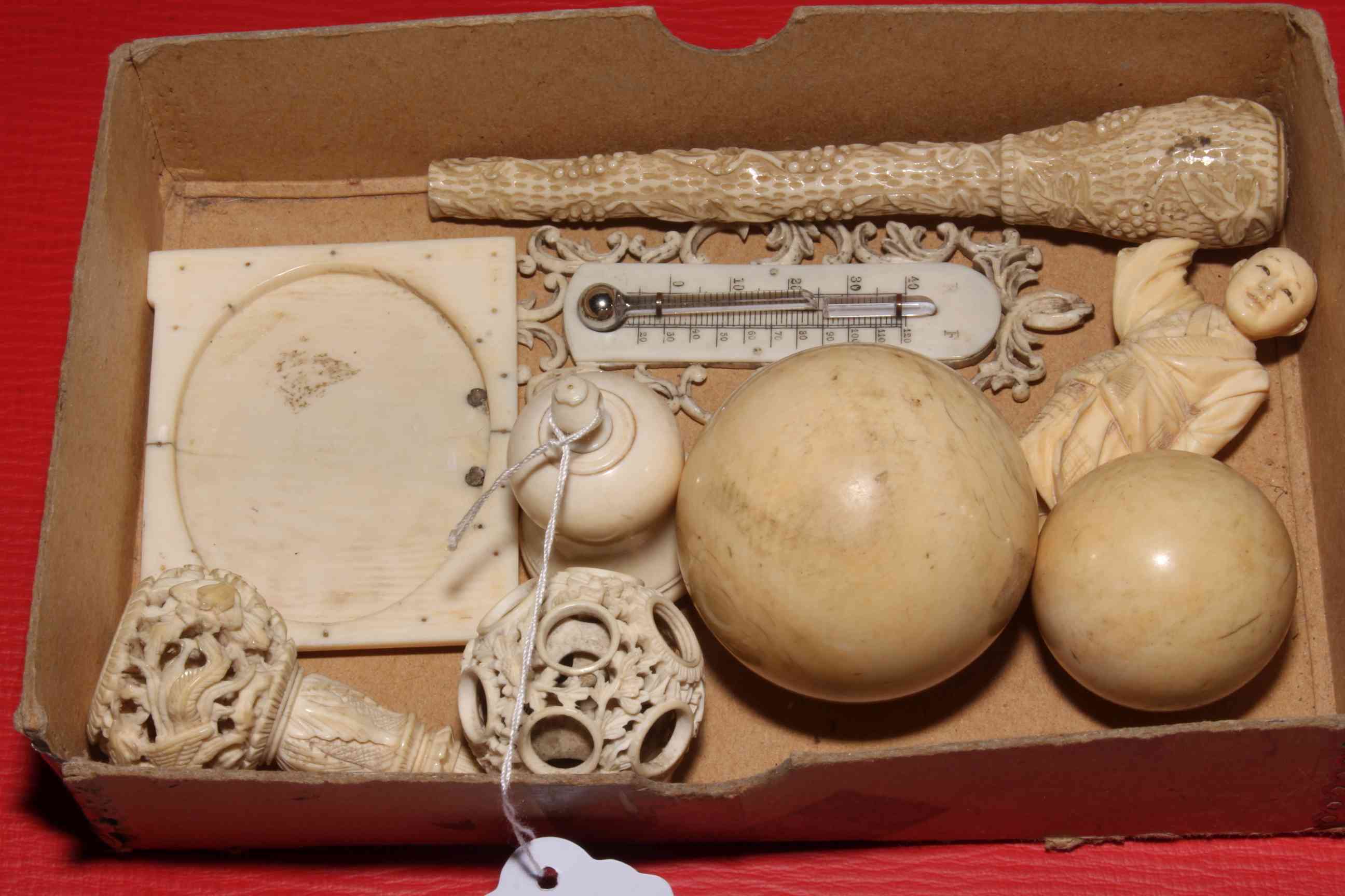 Box with antique ivory including snooker ball, concentric circles, parasol handle, frame, etc (9).