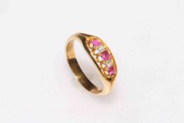 Ruby and diamond five stone 18 carat gold ring, size Q/R.