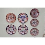 Seven Oriental Imari chargers (one octagonal charger restored).