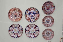 Seven Oriental Imari chargers (one octagonal charger restored).