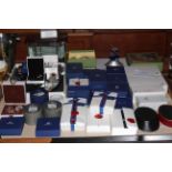 Large collection of mostly boxed Swarovski including display cabinet, mirror and other stands,