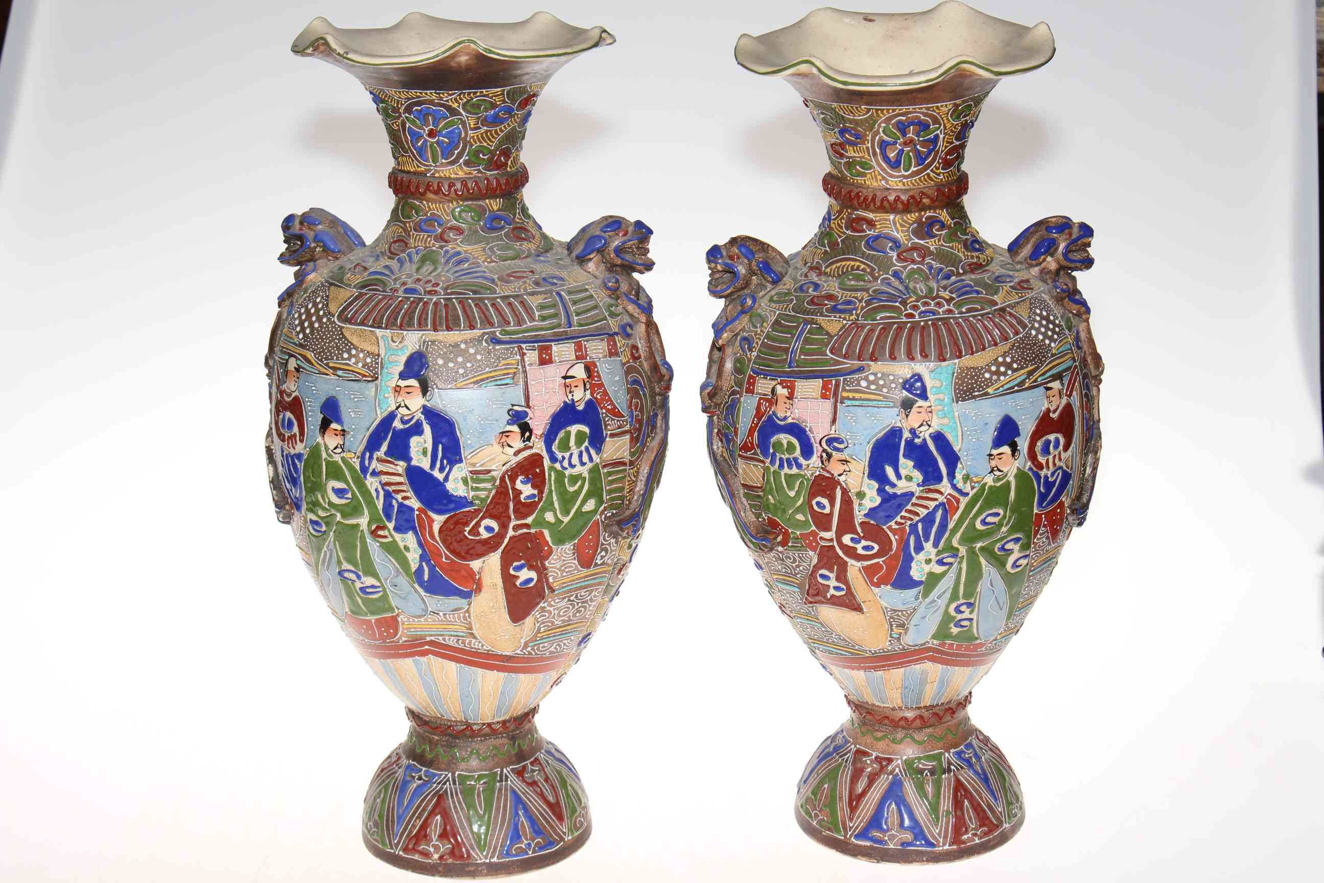 Pair large Oriental pottery vases with profuse figure and patterned decoration, 45cm.