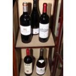 Five bottles or red wine including Chateau Pape Clement, Tignanello, Saint Emilion, etc.