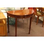 G & W Richardson Ltd, London, mahogany single drawer demi lune hall table, 77cm by 90.5cm by 45cm.