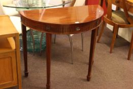 G & W Richardson Ltd, London, mahogany single drawer demi lune hall table, 77cm by 90.5cm by 45cm.