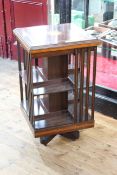 Inlaid mahogany two tier revolving bookcase, 82cm by 47cm by 47cm.