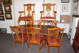 Twin pedestal extending dining table and two leaves together with a set of eight Chippendale style