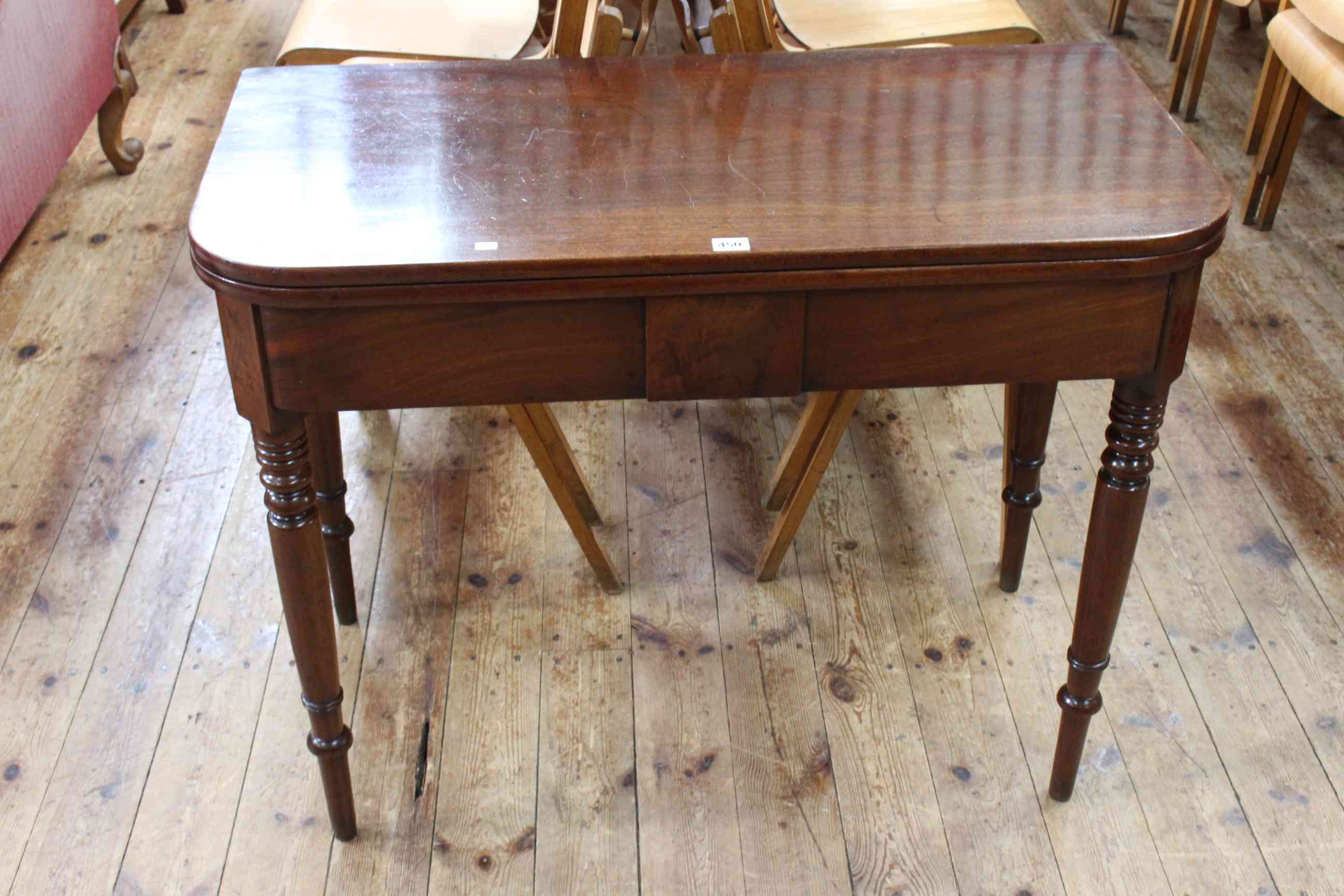 Victorian mahogany fold top tea table on ring turned legs, 75cm by 96cm by 48cm (closed).