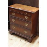 Line inlaid Bachelors chest having brush slide above three long drawers, 71cm by 62cm by 30cm.
