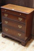 Line inlaid Bachelors chest having brush slide above three long drawers, 71cm by 62cm by 30cm.