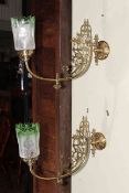 Pair of ornate brass wall lights with green tinted etched glass shades.