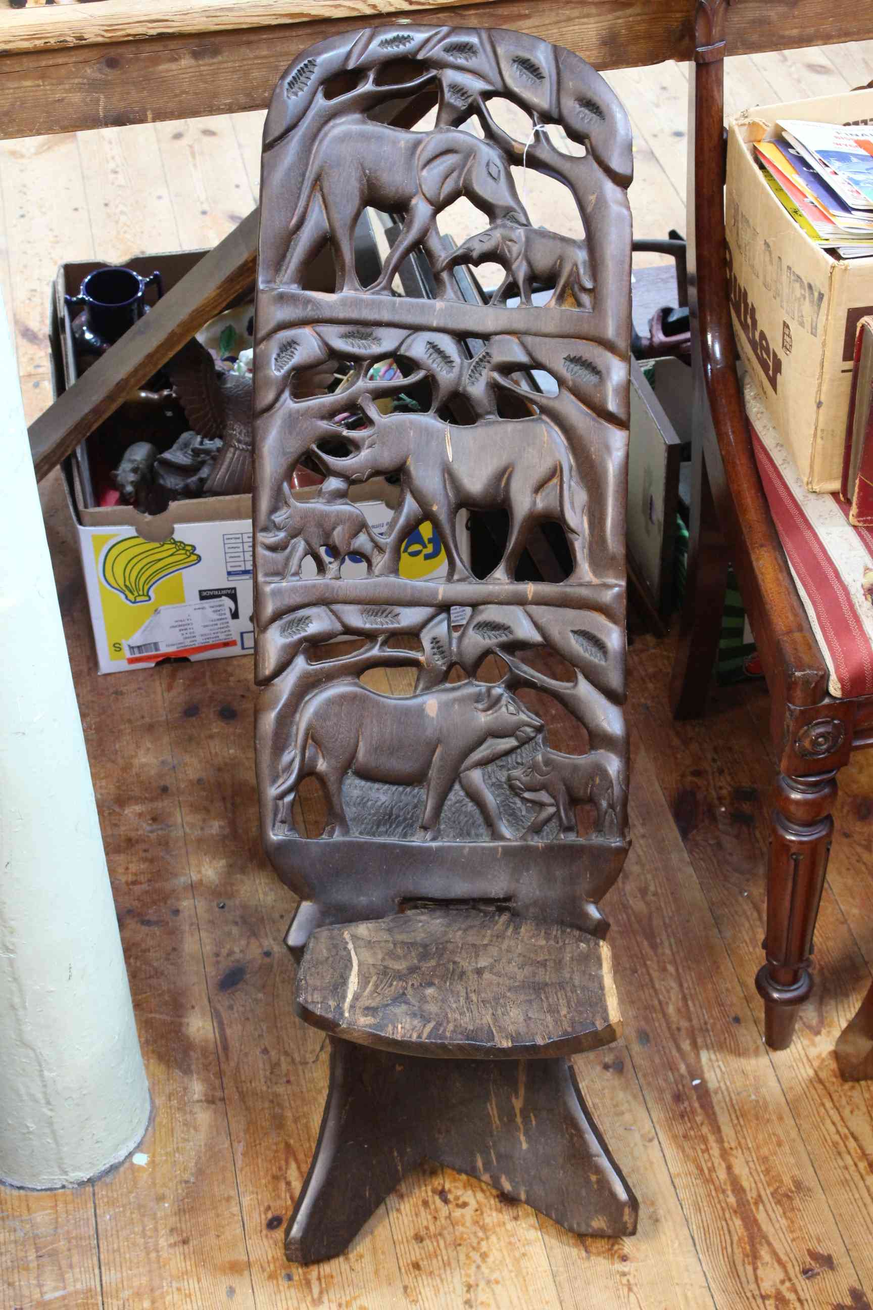 Carved African birthing chair.