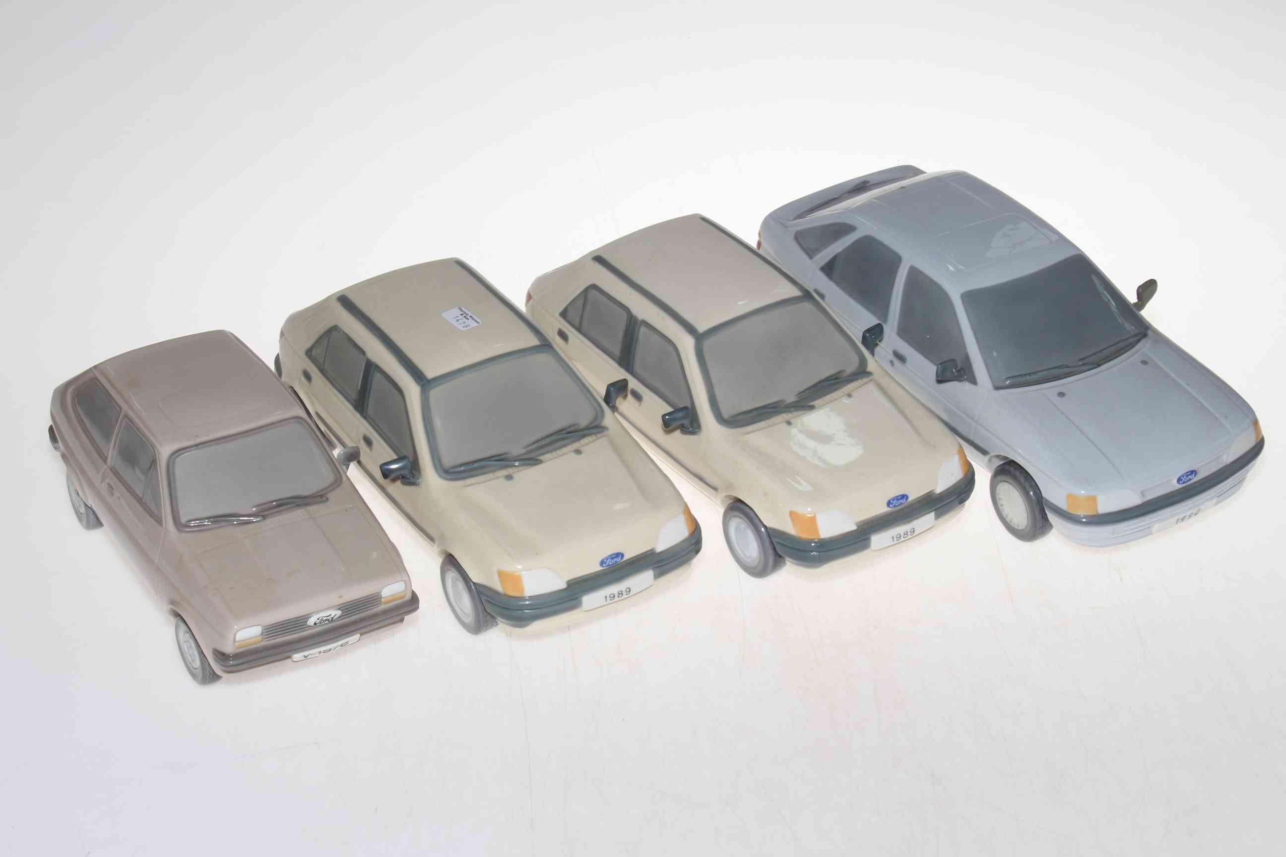 Four Lladro FORD model cars.
