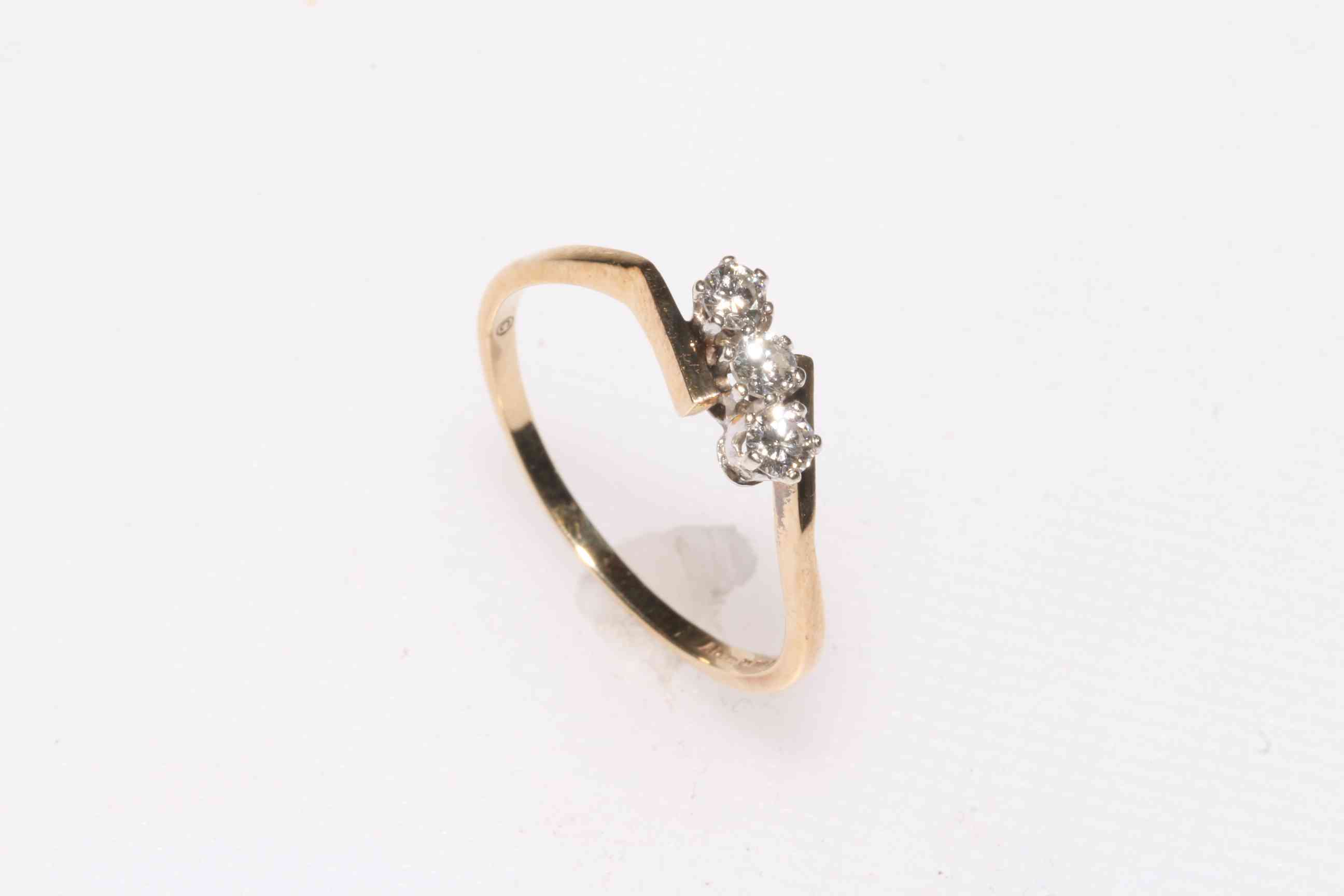 Diamond three stone 9 carat gold ring, size R.