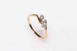 Diamond three stone 9 carat gold ring, size R.