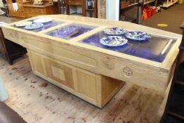 Light oak book of remembrance table cabinet, 88cm by 264cm by 79cm.