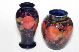 Moorcroft Pomegranate ginger jar (lacking lid), 79cm, together with Pomegranate vase (restored),